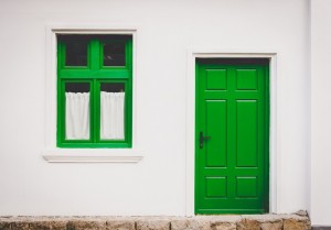 A green doored-house leading to a bath lift in North Devon