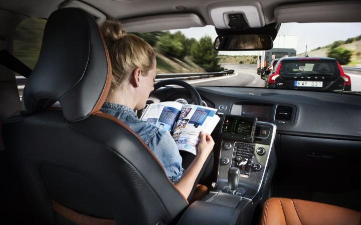 Disabled woman drives autonomous car.