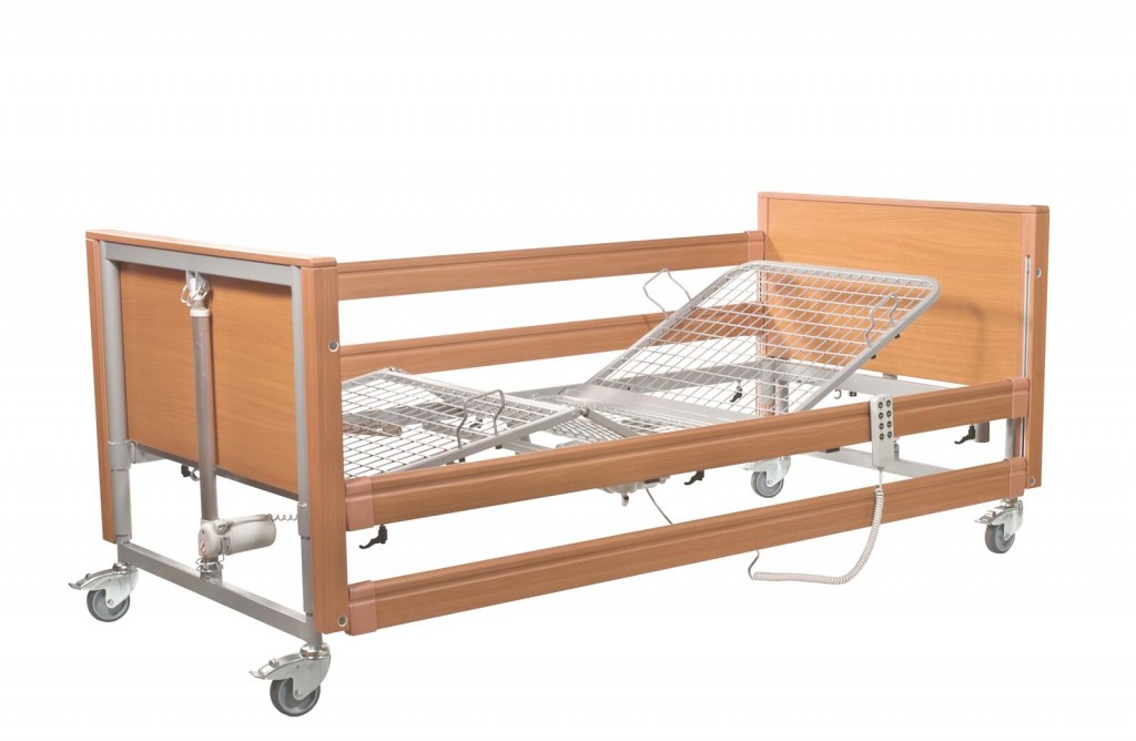 Bed with side rail and mattress lifter