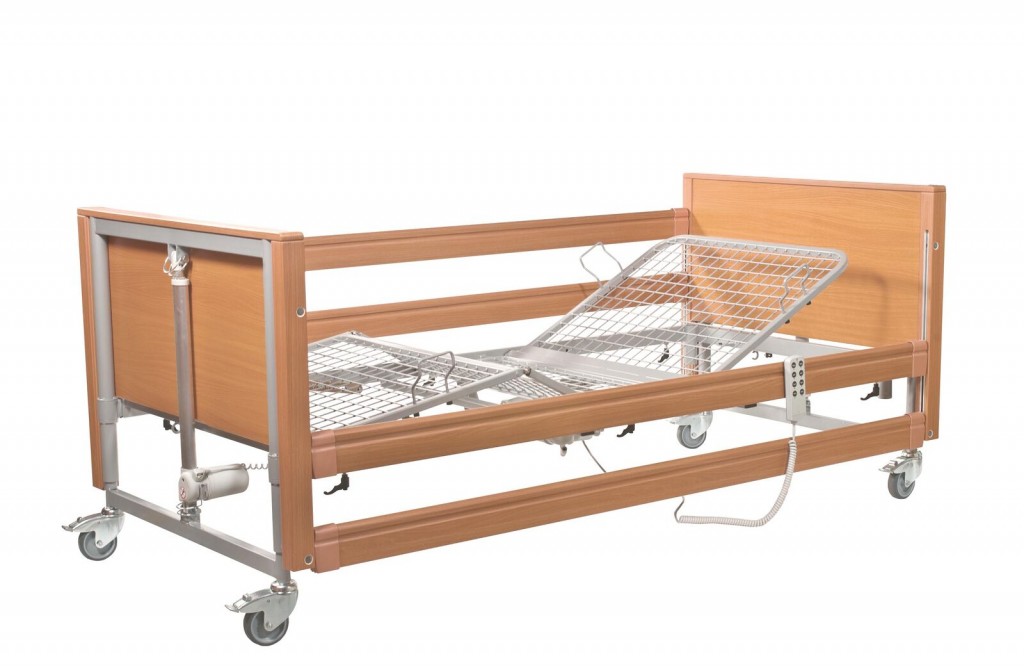 Bed with side rail and mattress lifter