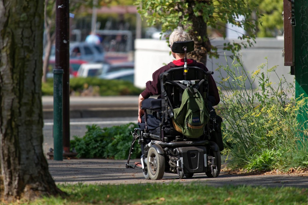 a person using a mobility scooter in a park 