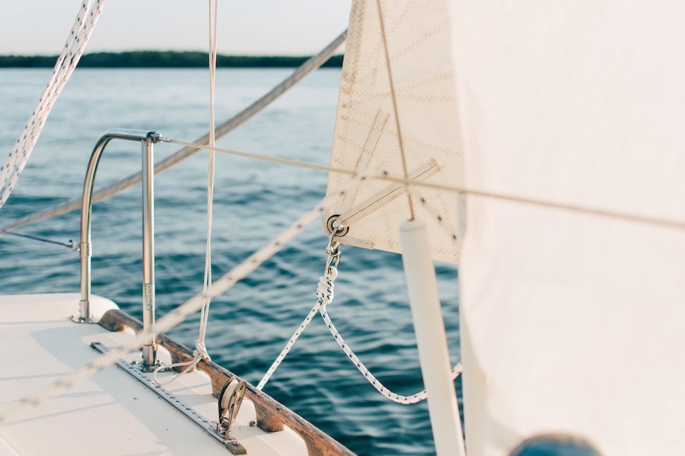 Close up on the deck of a white yacht.